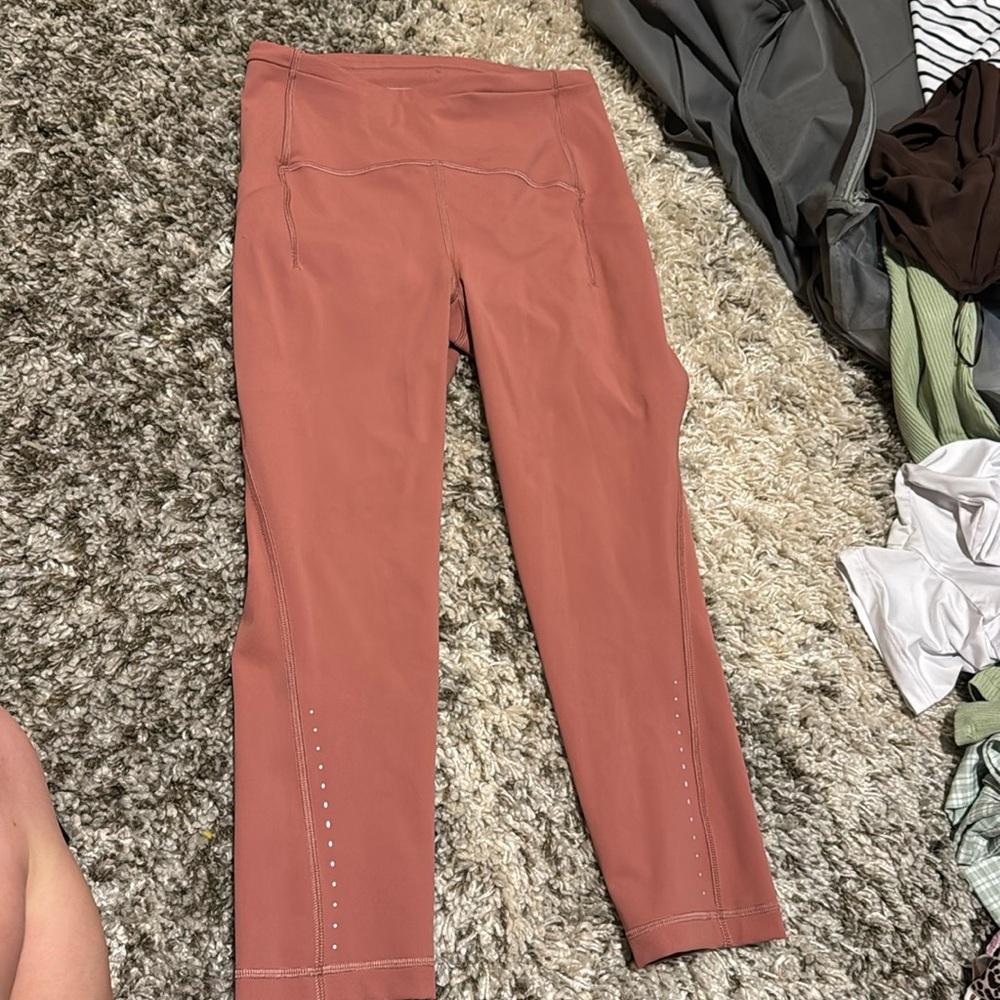 Never worn- peachy color